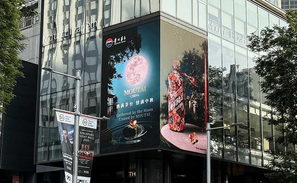 Moutai Mid-Autumn campaign on a vertical LED screen on a building corner in Singapore