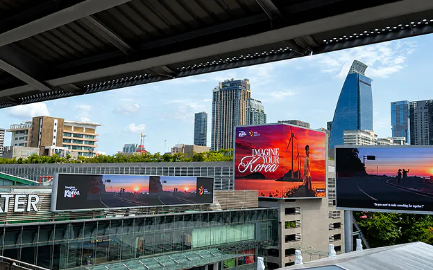 Imagine Your Korea billboards above a shopping centre in Bangkok, Thailand